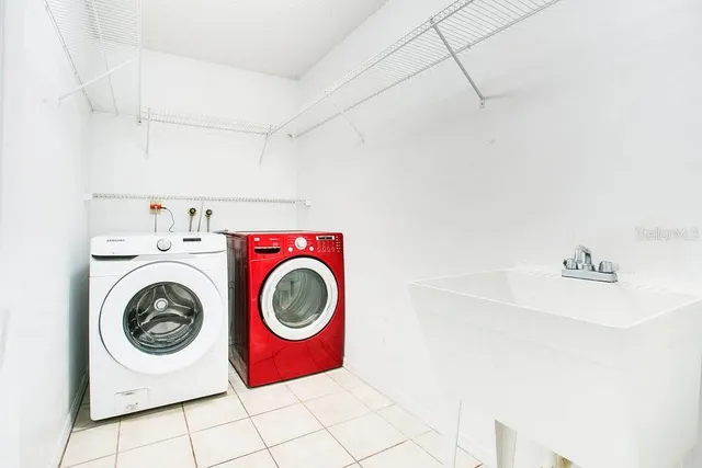 a utility room with dryer and washer