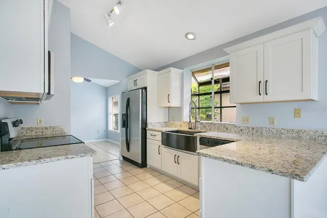 a kitchen with a sink and cabinets
