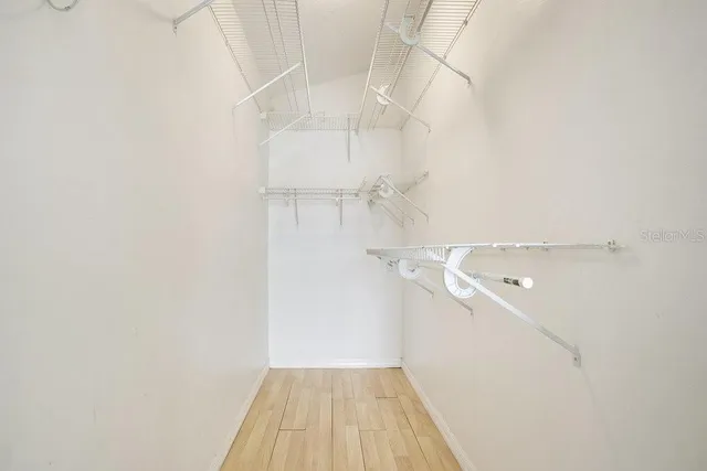 a view of a room with wooden floor