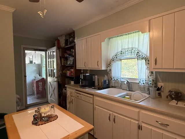 a view of a dining room with furniture and window