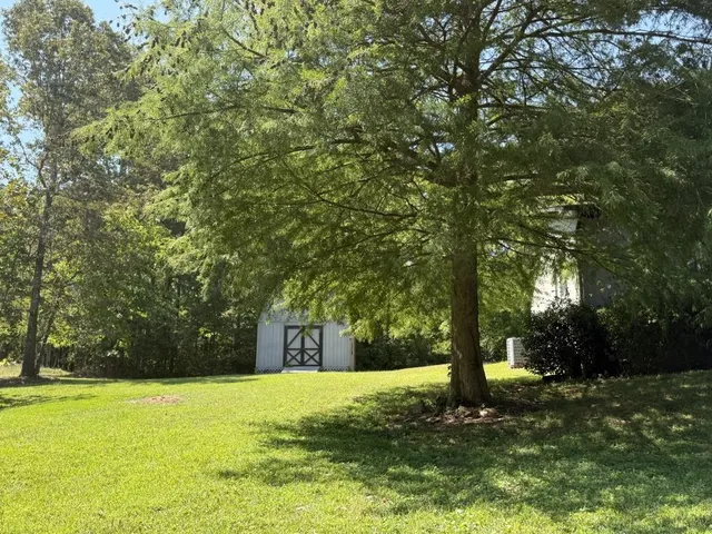 a house view with a garden space