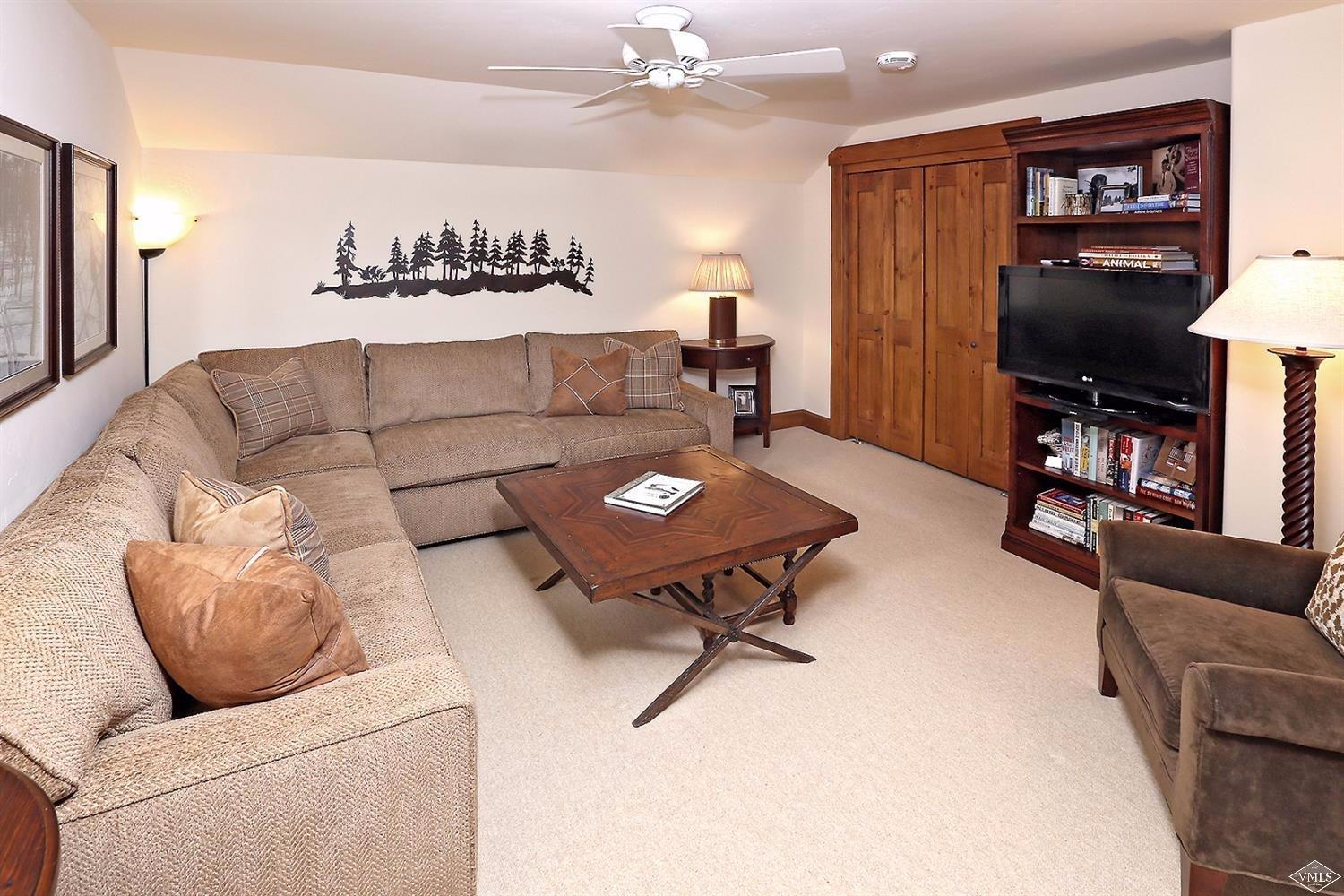 404 Cresta Road Edwards, CO 81632 - Photo 11 of 24 a living room with furniture and a flat screen tv