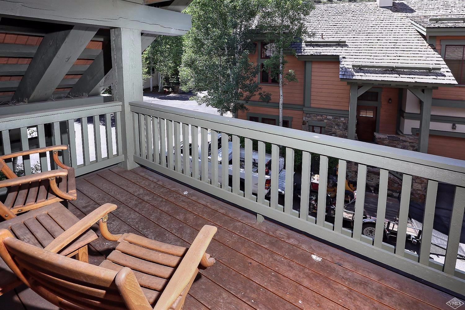 404 Cresta Road Edwards, CO 81632 - Photo 12 of 24 a balcony with wooden floor outdoor seating and yard in the back