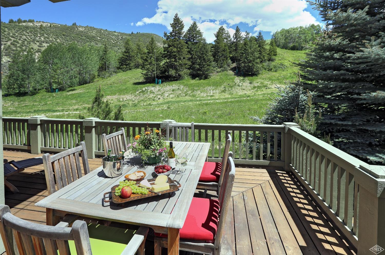 404 Cresta Road Edwards, CO 81632 - Photo 17 of 24 a balcony with wooden floor and outdoor seating