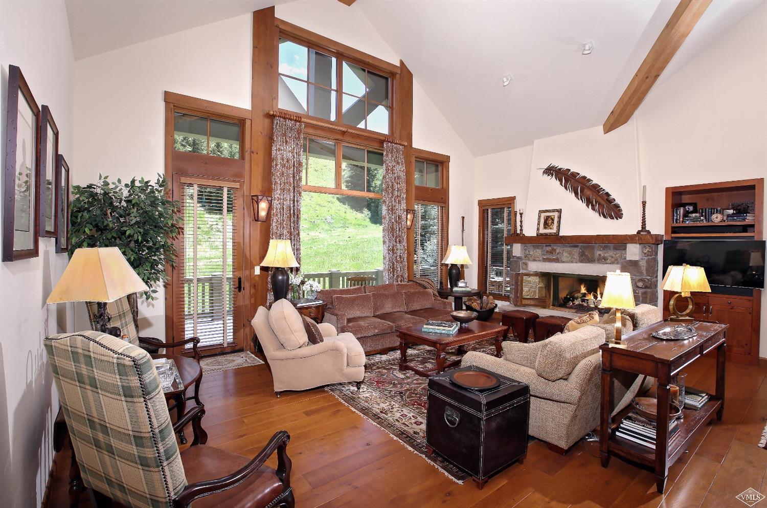 404 Cresta Road Edwards, CO 81632 - Photo 18 of 24 a living room with furniture fireplace and a large window