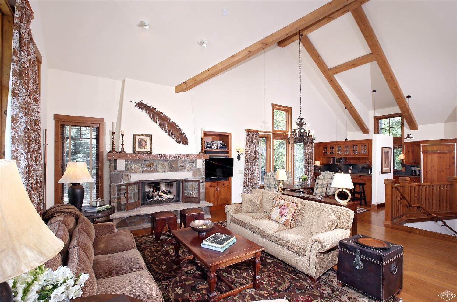 404 Cresta Road Edwards, CO 81632 - Photo 19 of 24 a living room with furniture a fireplace and a large window
