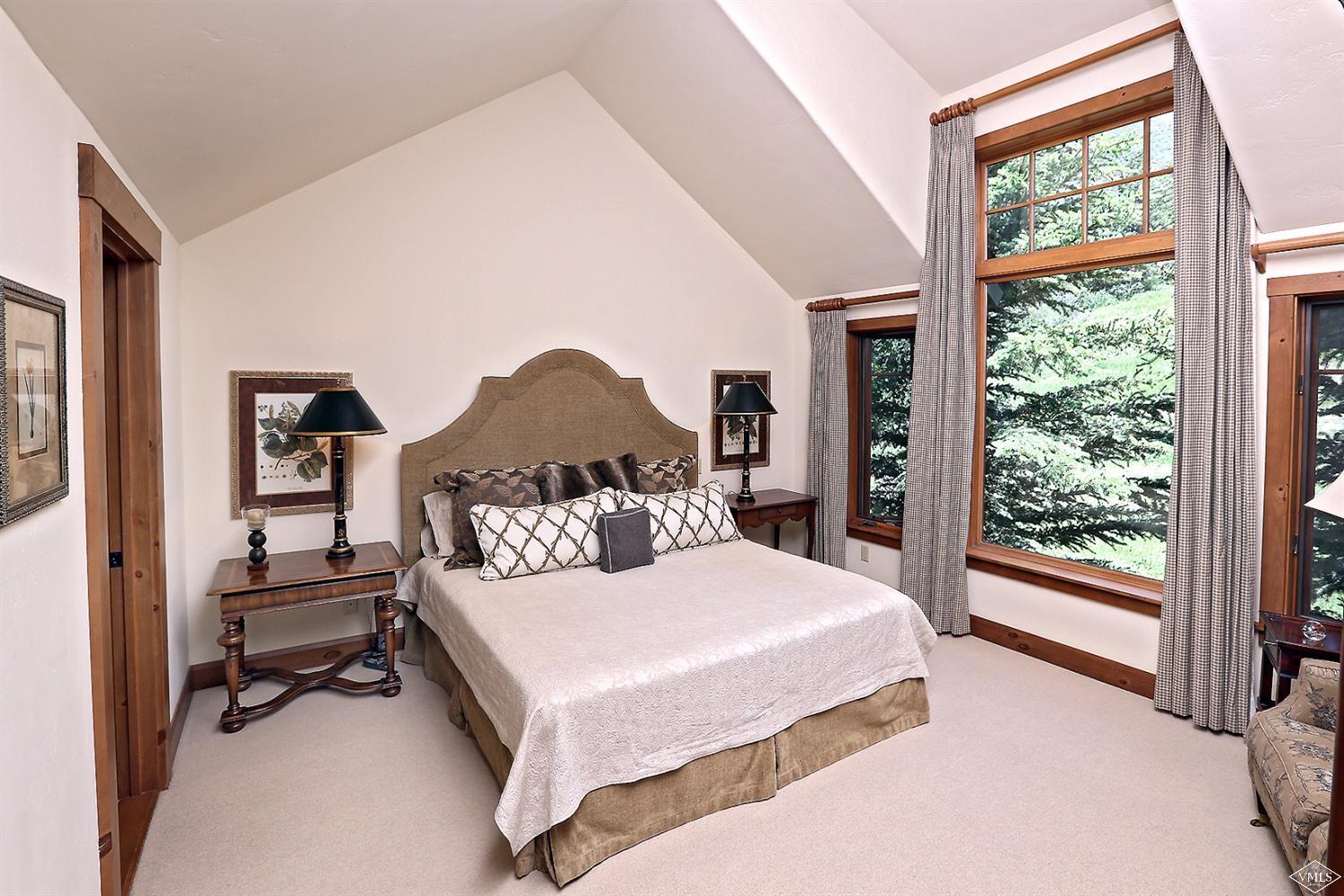 404 Cresta Road Edwards, CO 81632 - Photo 20 of 24 a bedroom with a large bed and a large window