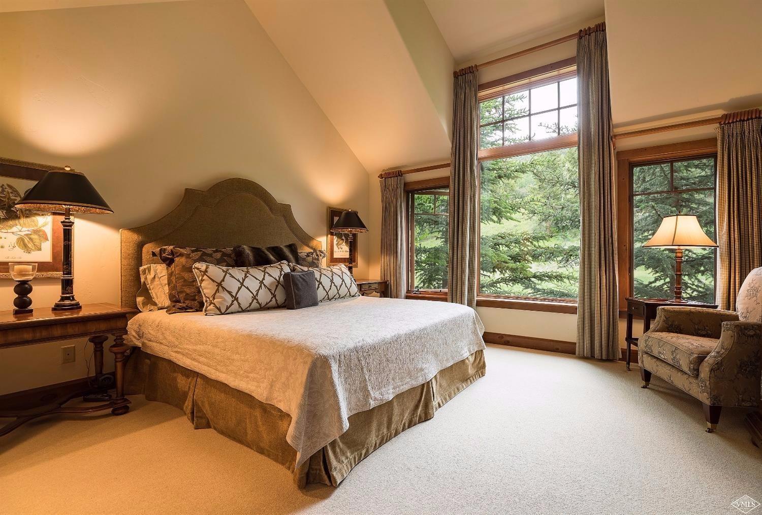 404 Cresta Road Edwards, CO 81632 - Photo 2 of 24 a bedroom with a bed and a large window