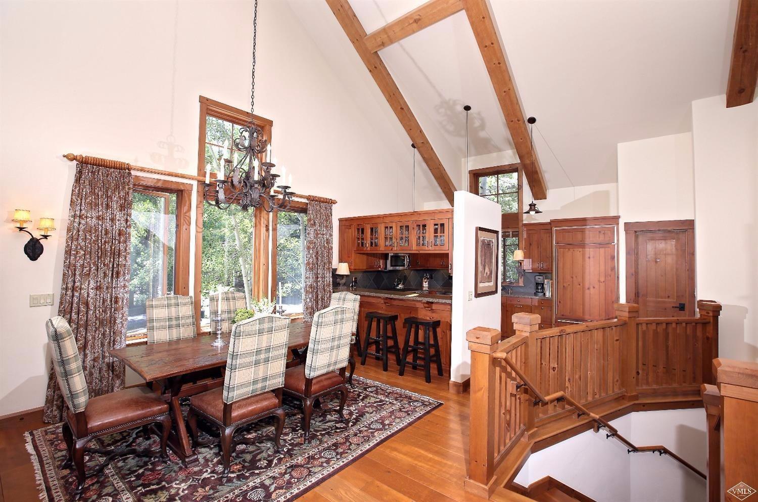 404 Cresta Road Edwards, CO 81632 - Photo 4 of 24 a view of a dining room with furniture window and wooden floor