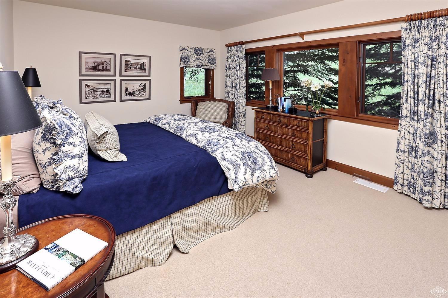 404 Cresta Road Edwards, CO 81632 - Photo 8 of 24 a bedroom with a large bed and a window