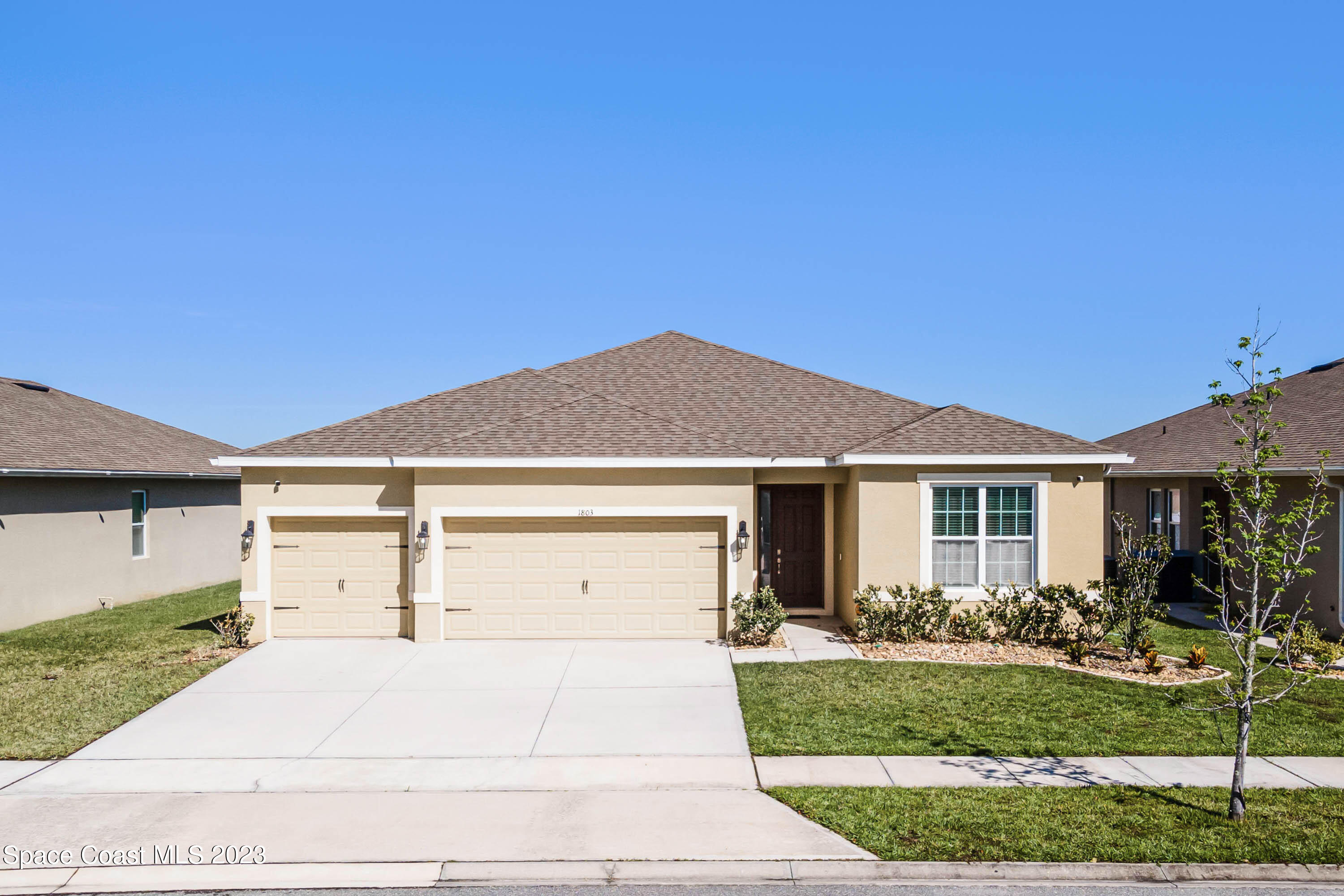 1803 Brockridge Road Kissimmee, FL 34744 - Photo 1 of 46 a front view of house with yard