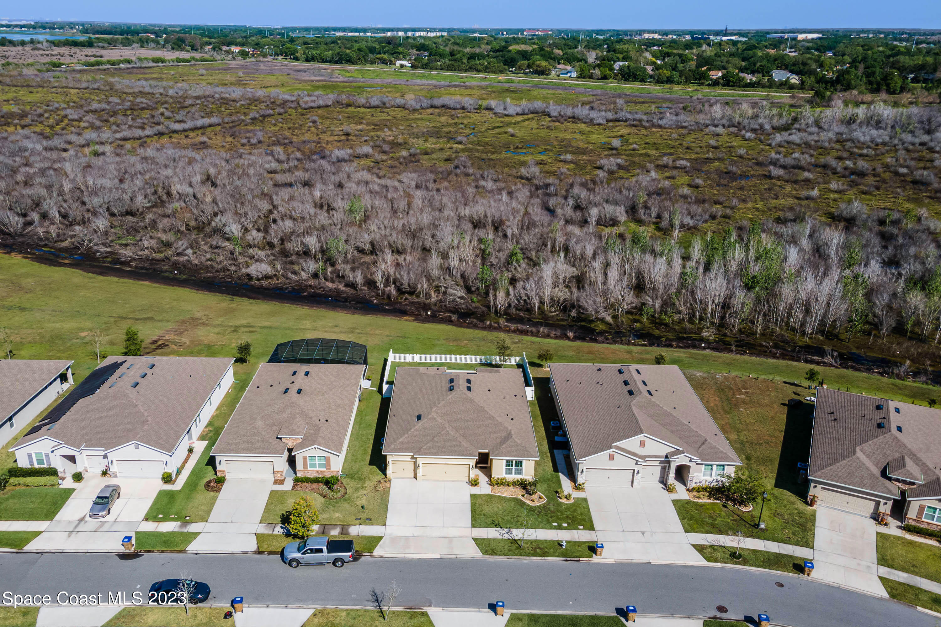 1803 Brockridge Road Kissimmee, FL 34744 - Photo 12 of 46 an aerial view of residential houses with outdoor space and lake view