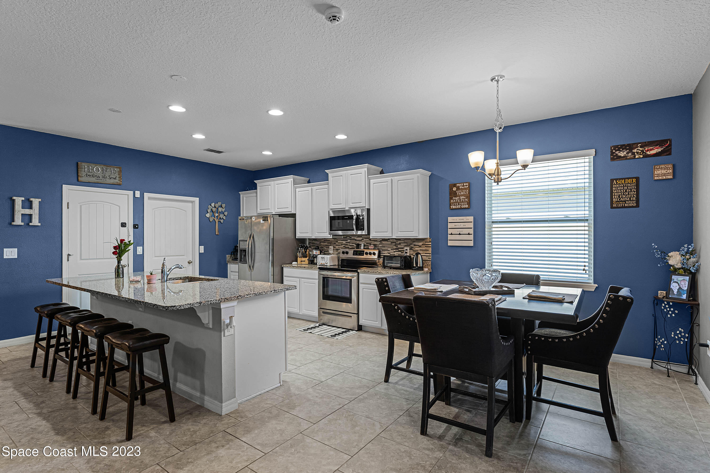 1803 Brockridge Road Kissimmee, FL 34744 - Photo 16 of 46 a view of a dining room with furniture