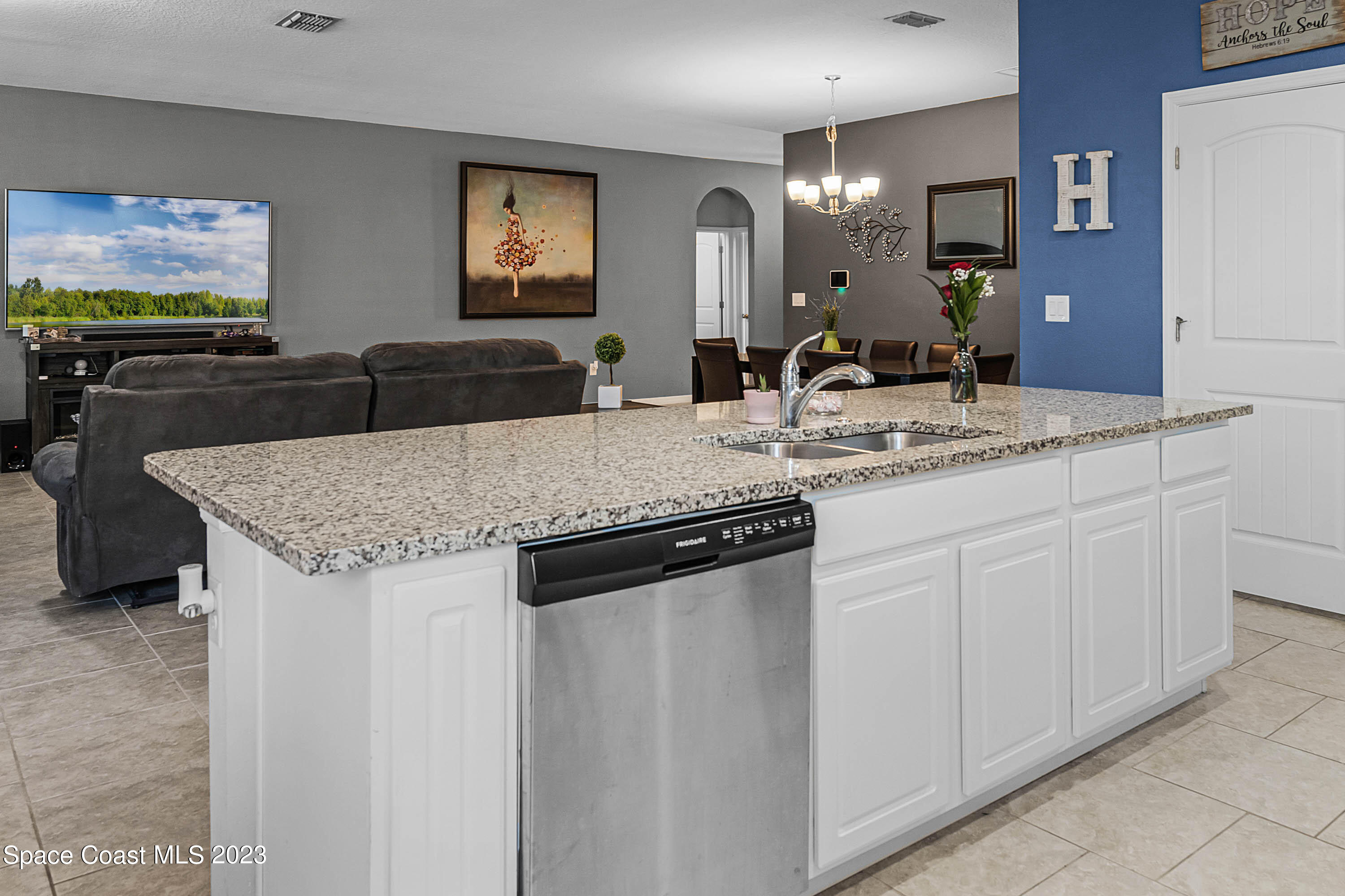 1803 Brockridge Road Kissimmee, FL 34744 - Photo 18 of 46 a kitchen with stainless steel appliances granite countertop a sink and a refrigerator