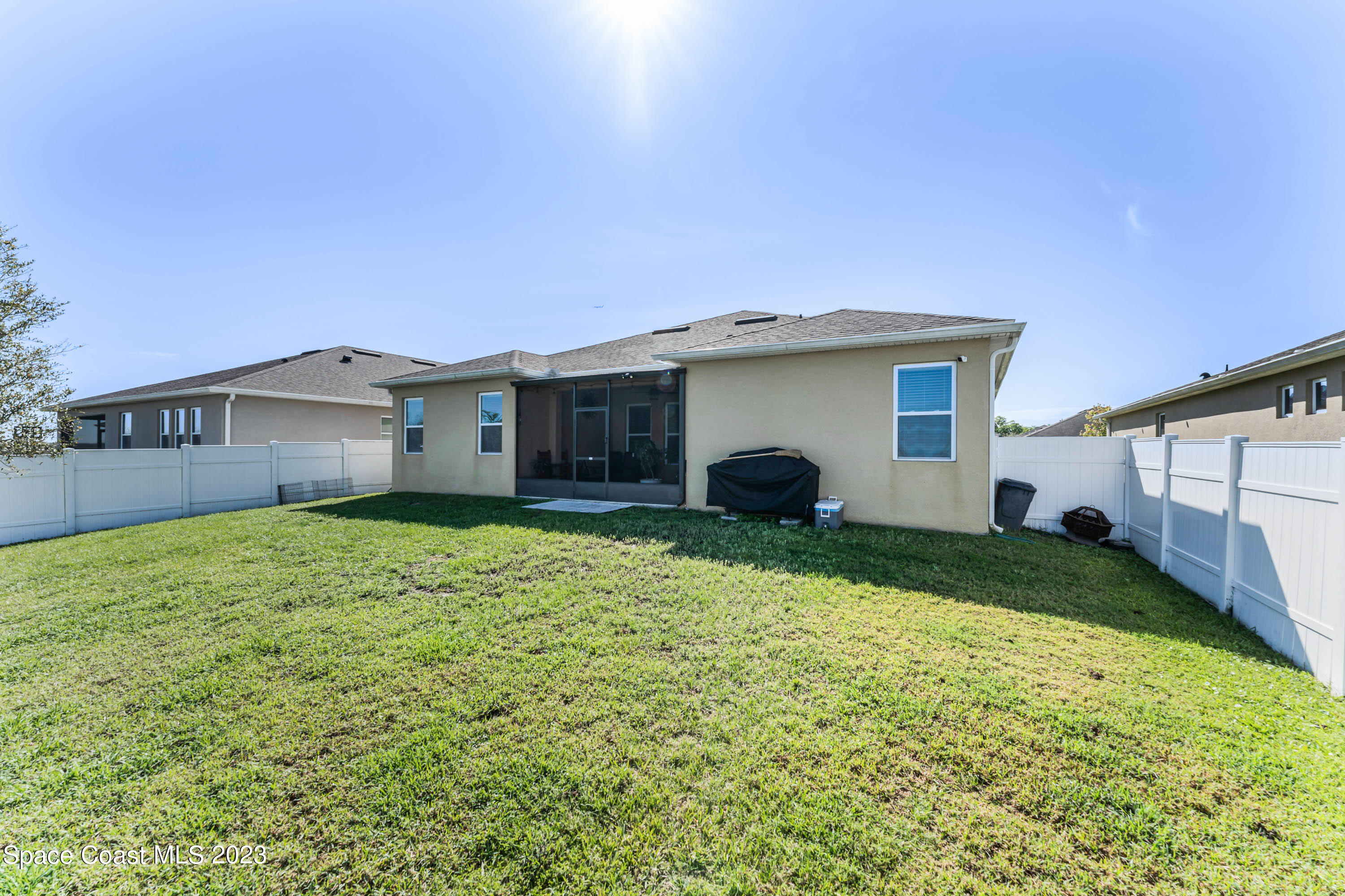 1803 Brockridge Road Kissimmee, FL 34744 - Photo 2 of 46 a view of a house with a yard and garage
