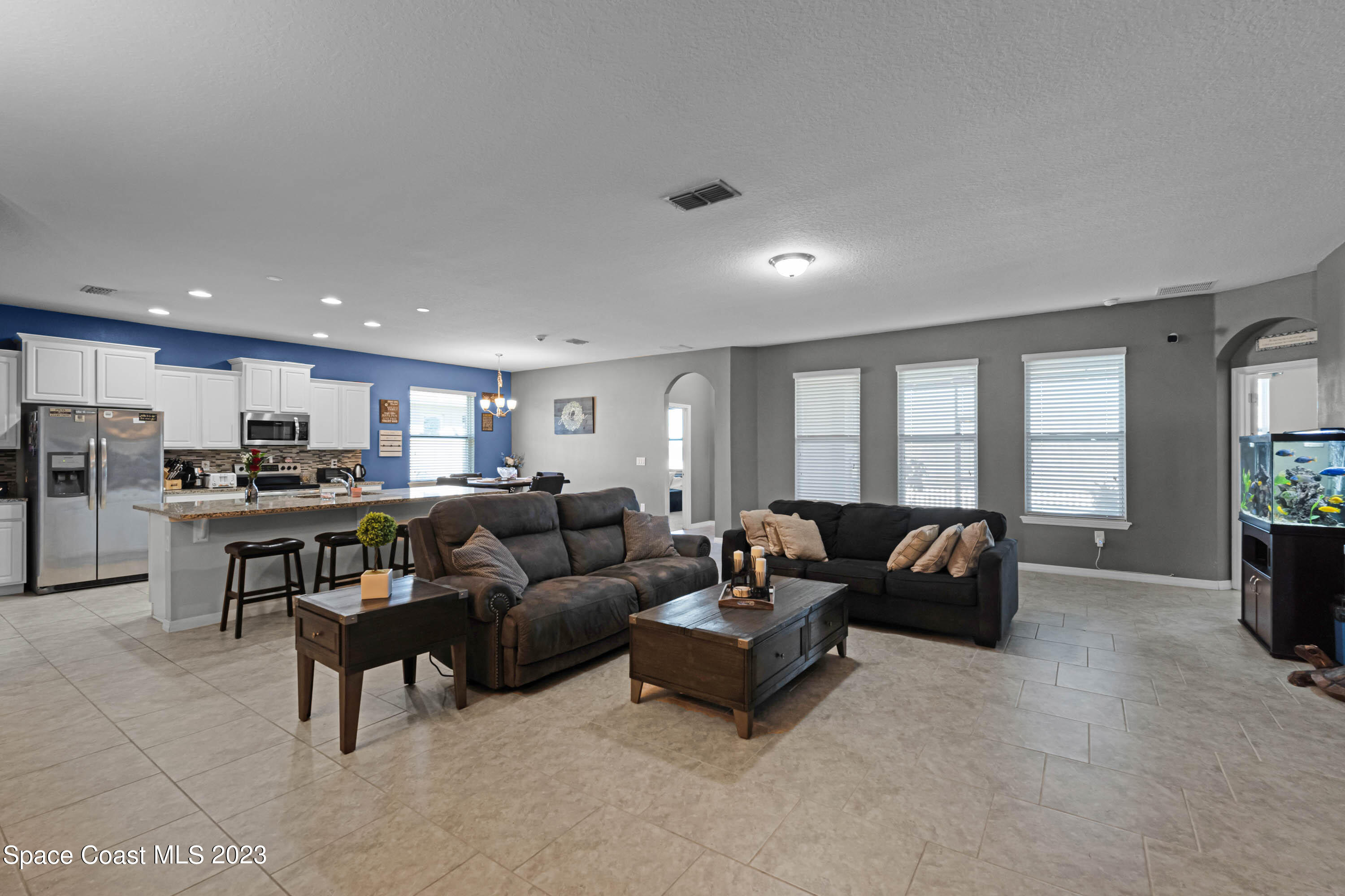 1803 Brockridge Road Kissimmee, FL 34744 - Photo 22 of 46 a living room with furniture and a large window