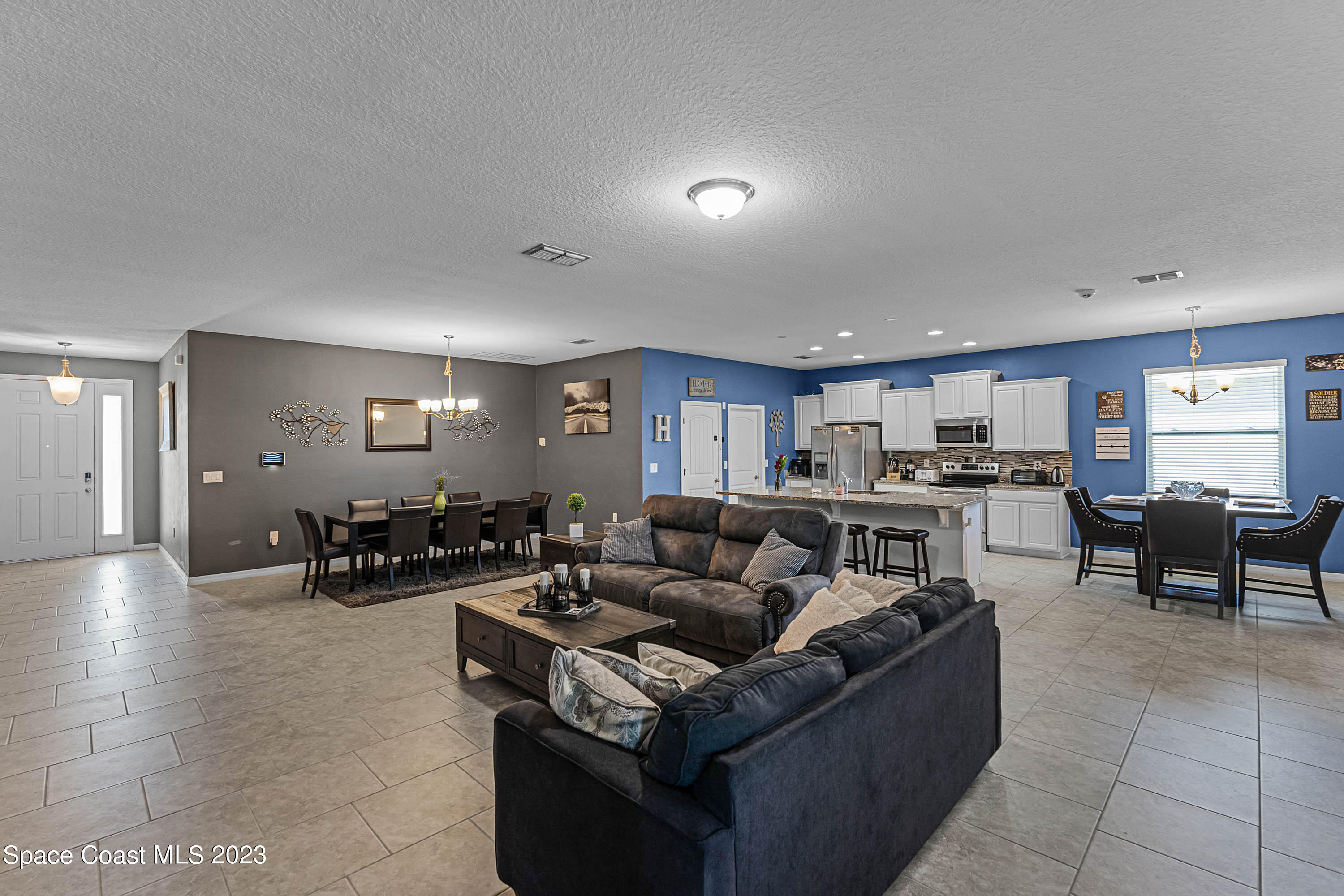1803 Brockridge Road Kissimmee, FL 34744 - Photo 24 of 46 a living room with furniture and wooden floor