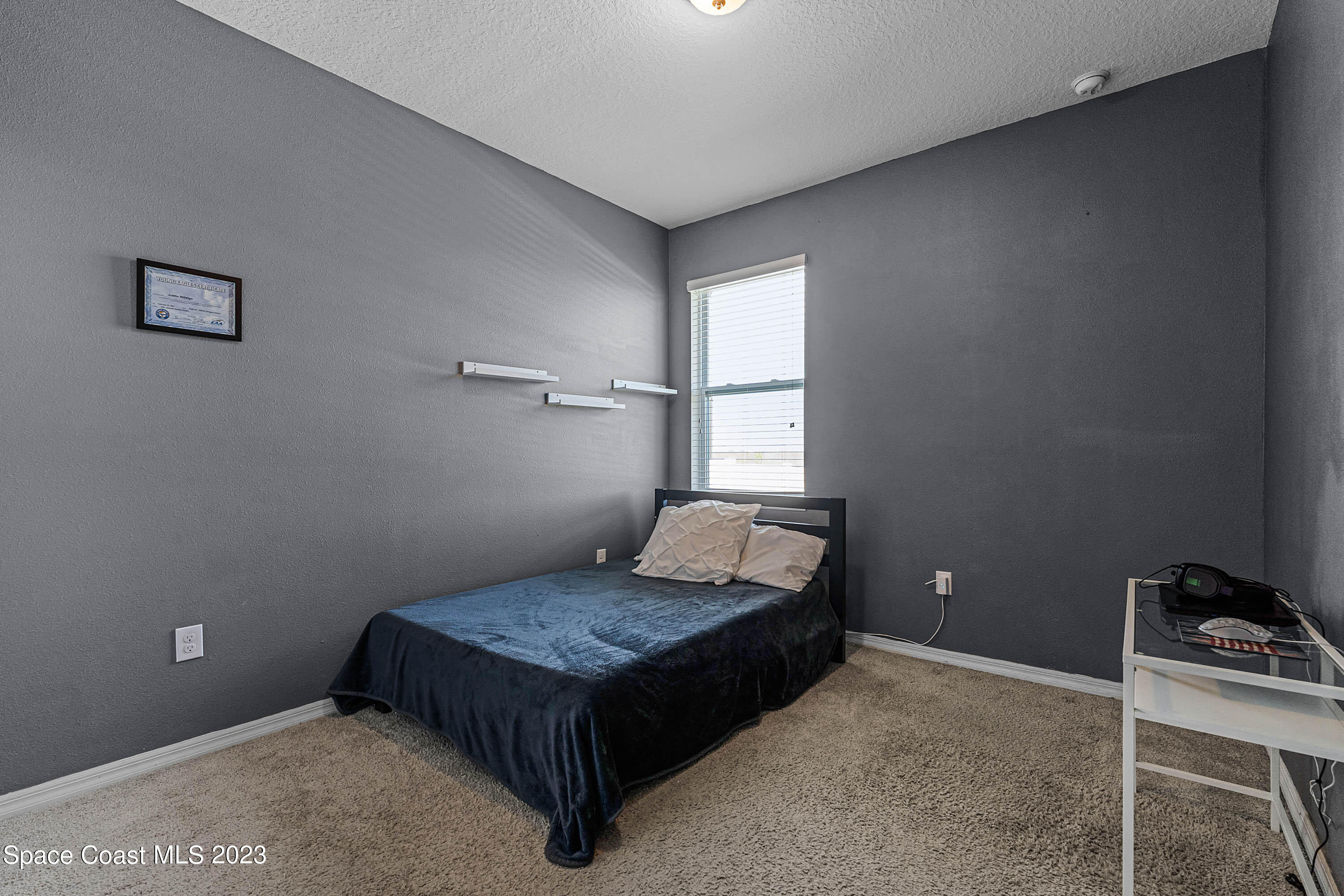 1803 Brockridge Road Kissimmee, FL 34744 - Photo 28 of 46 a room with a bed and a window