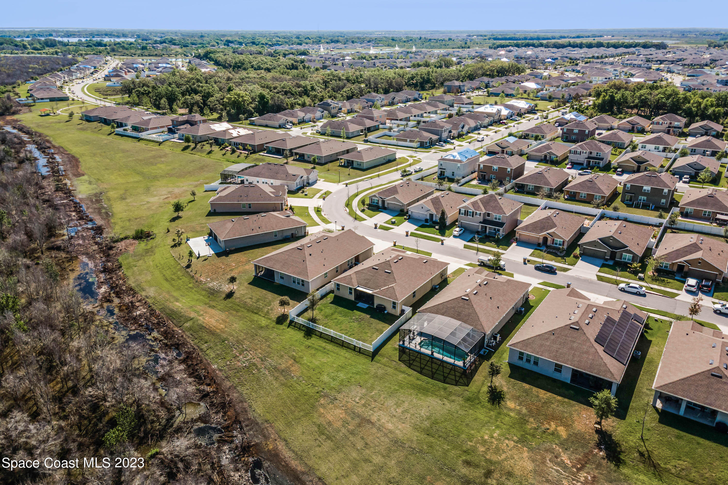1803 Brockridge Road Kissimmee, FL 34744 - Photo 37 of 46 an aerial view of a house with a lake view