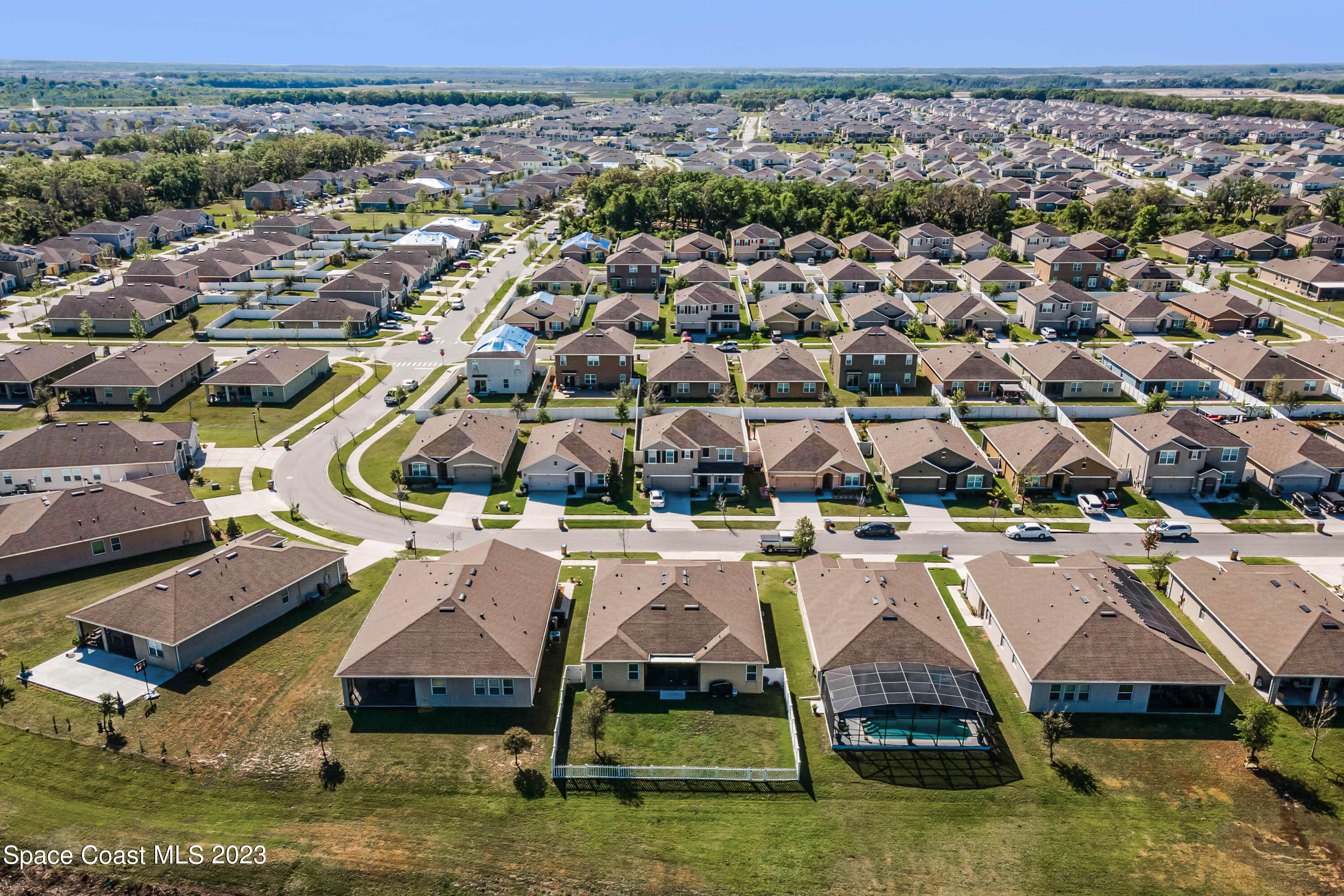1803 Brockridge Road Kissimmee, FL 34744 - Photo 38 of 46 an aerial view of residential houses with outdoor space and swimming pool