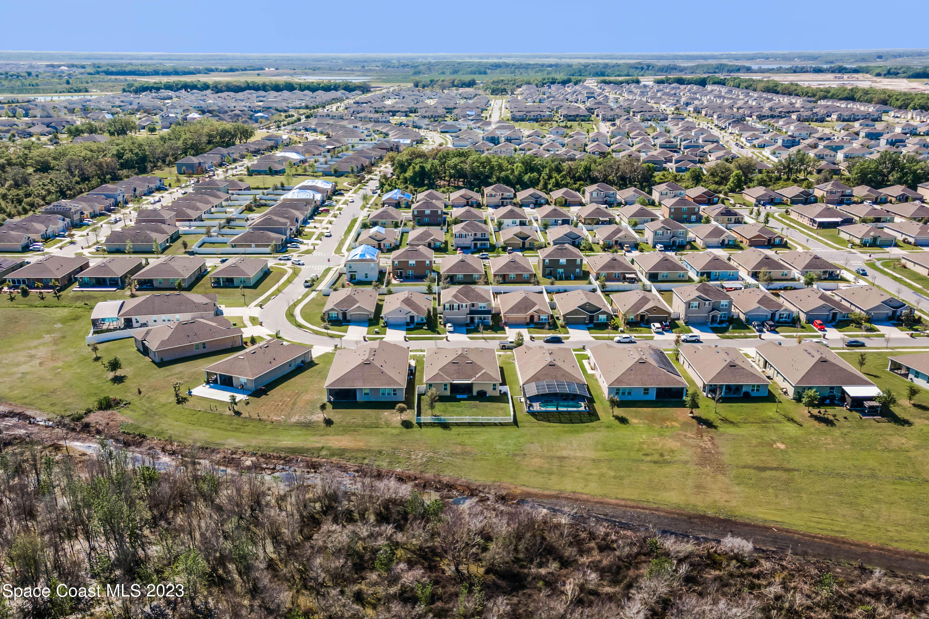 1803 Brockridge Road Kissimmee, FL 34744 - Photo 44 of 46 an aerial view of a house with a yard