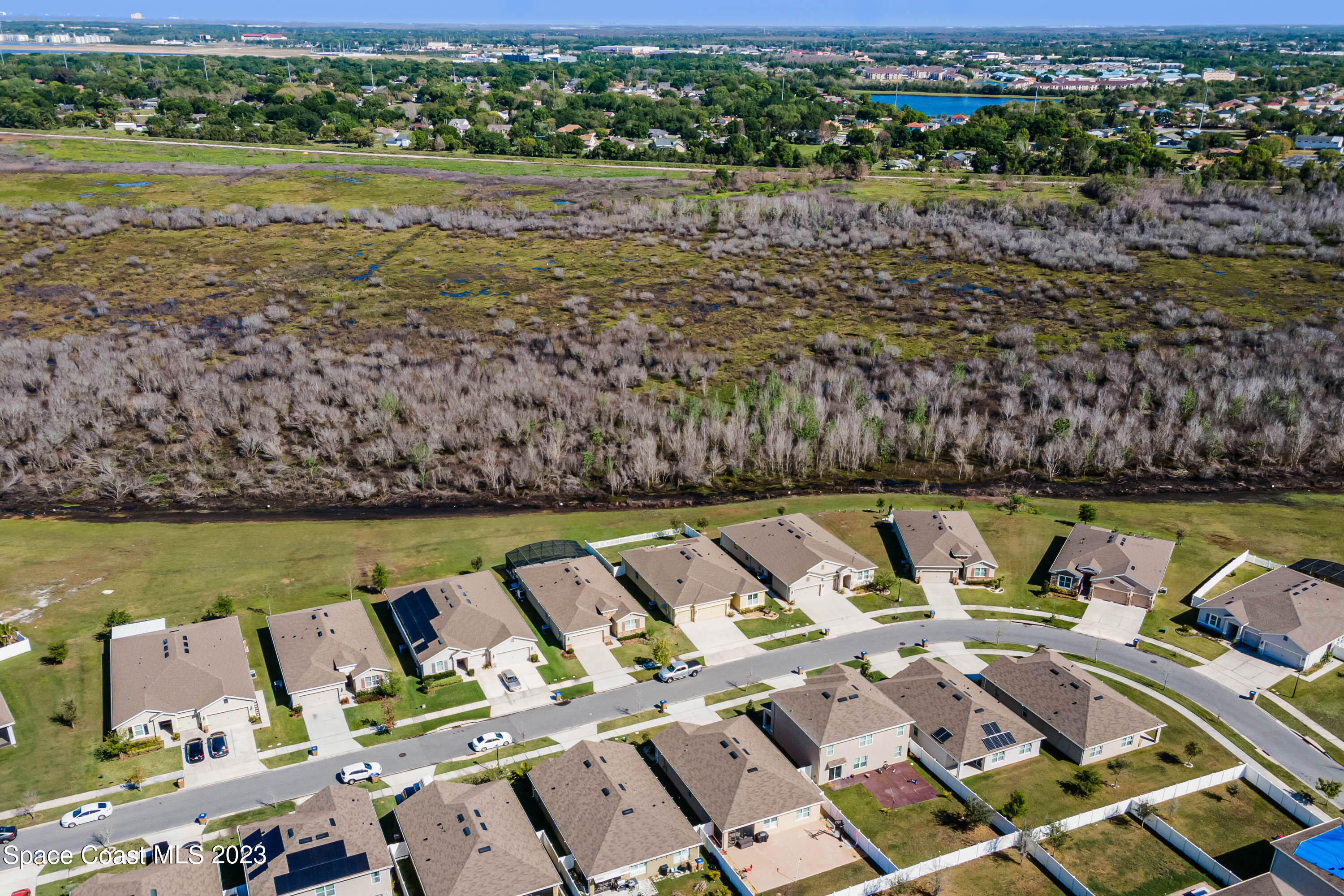 1803 Brockridge Road Kissimmee, FL 34744 - Photo 46 of 46 an aerial view of a house with a lake view