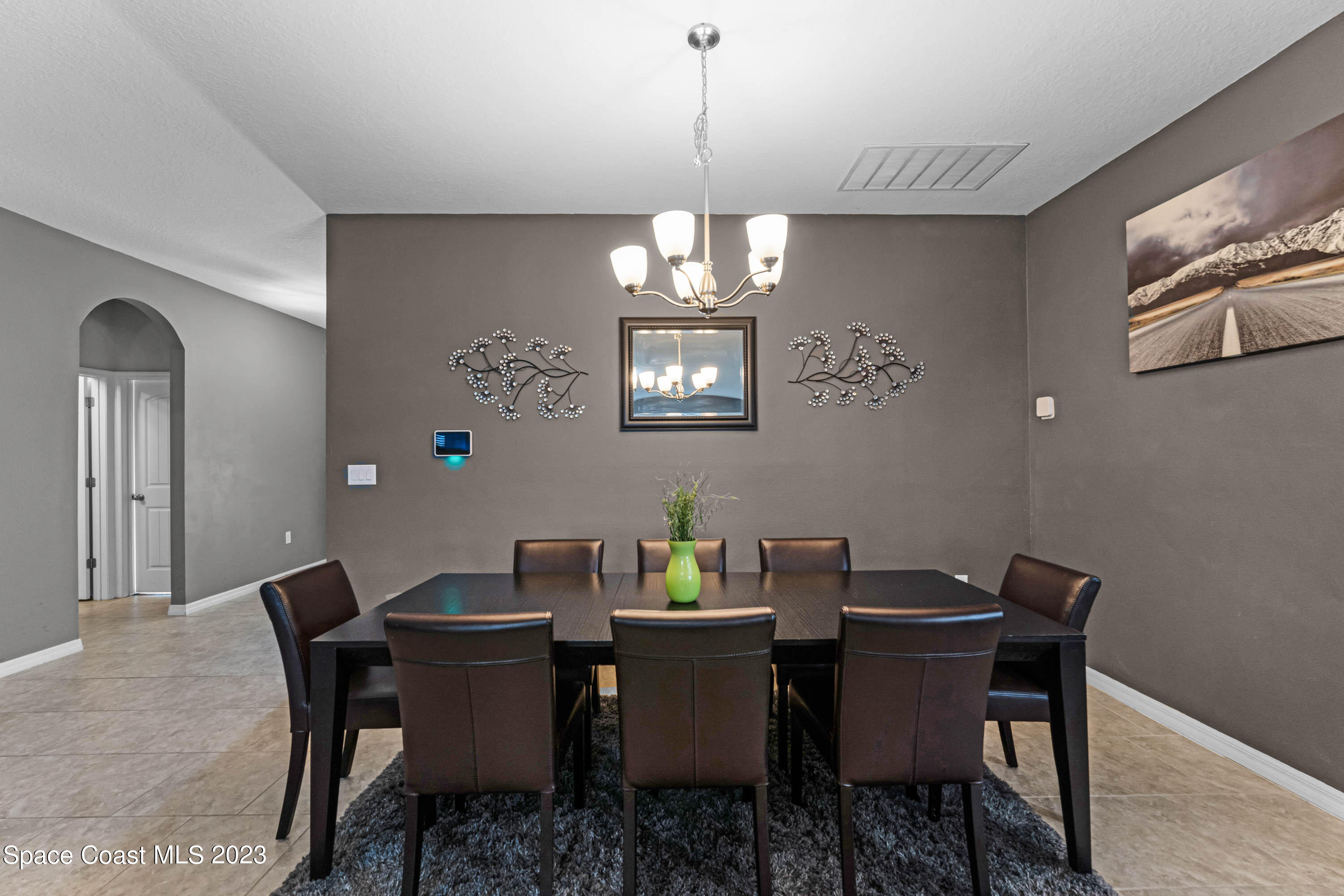 1803 Brockridge Road Kissimmee, FL 34744 - Photo 6 of 46 a view of a dining room with a table and chairs