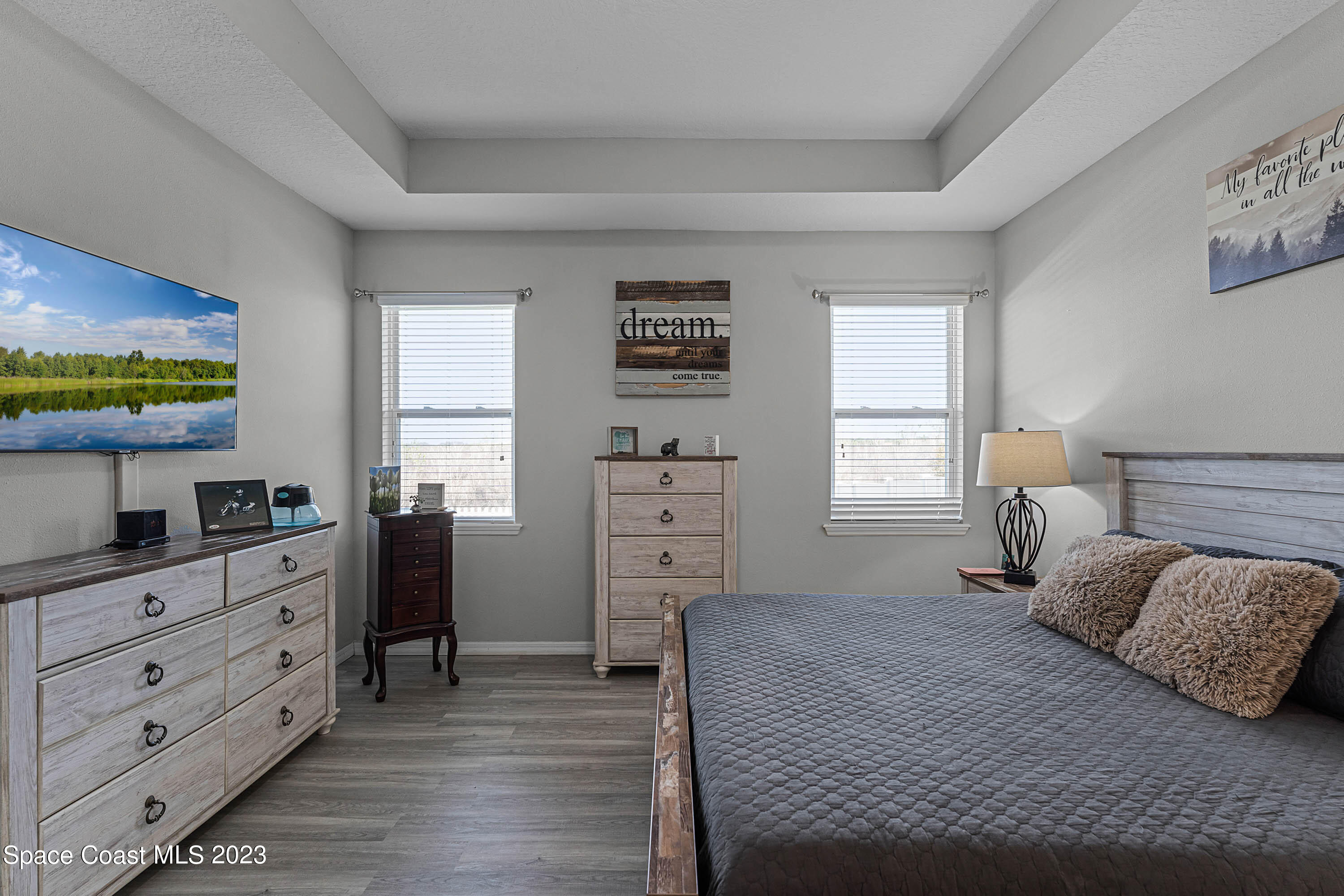 1803 Brockridge Road Kissimmee, FL 34744 - Photo 7 of 46 a bedroom with a bed and a dresser in it