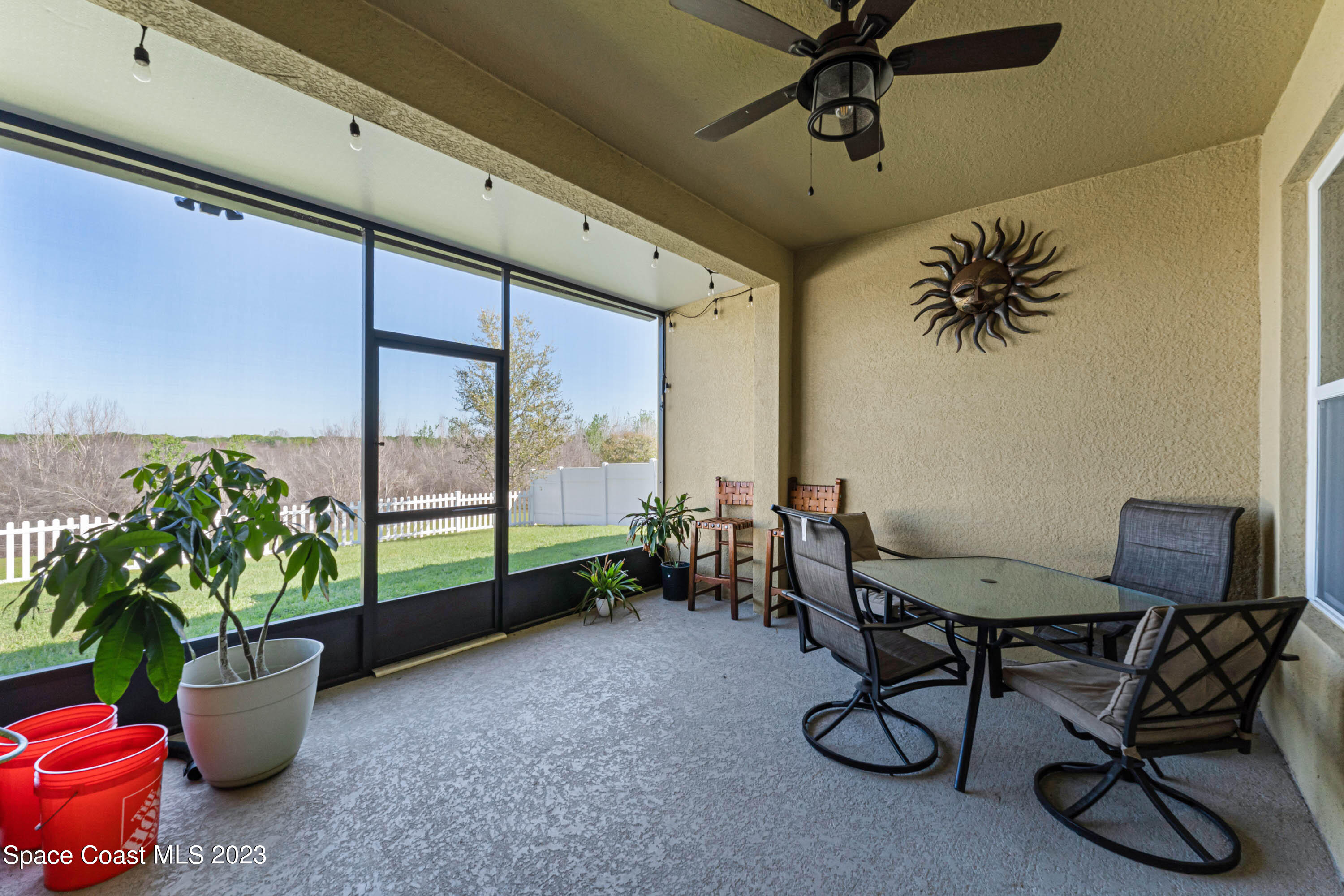 1803 Brockridge Road Kissimmee, FL 34744 - Photo 10 of 46 a view of a livingroom with furniture and a potted plant