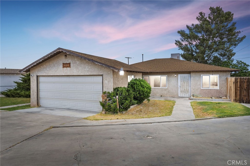 2567 Perth Court Barstow, CA 92311 - Photo 1 of 56 a front view of house with yard and trees