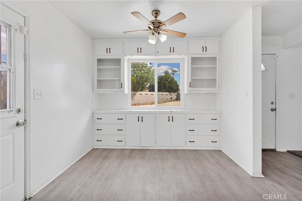 2567 Perth Court Barstow, CA 92311 - Photo 16 of 56 wooden floor in an empty room with a window