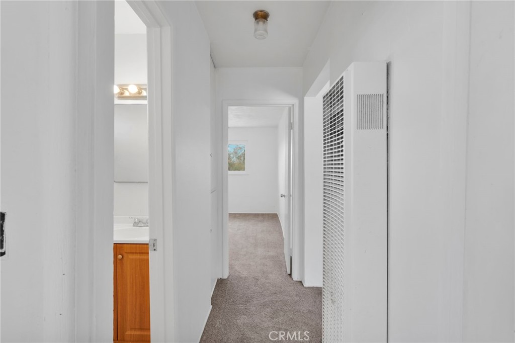 2567 Perth Court Barstow, CA 92311 - Photo 20 of 56 a view of a hallway with wooden floor