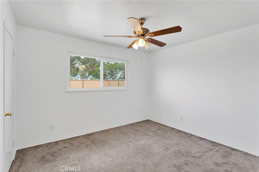 2567 Perth Court Barstow, CA 92311 - Photo 25 of 56 an empty room with windows and fan