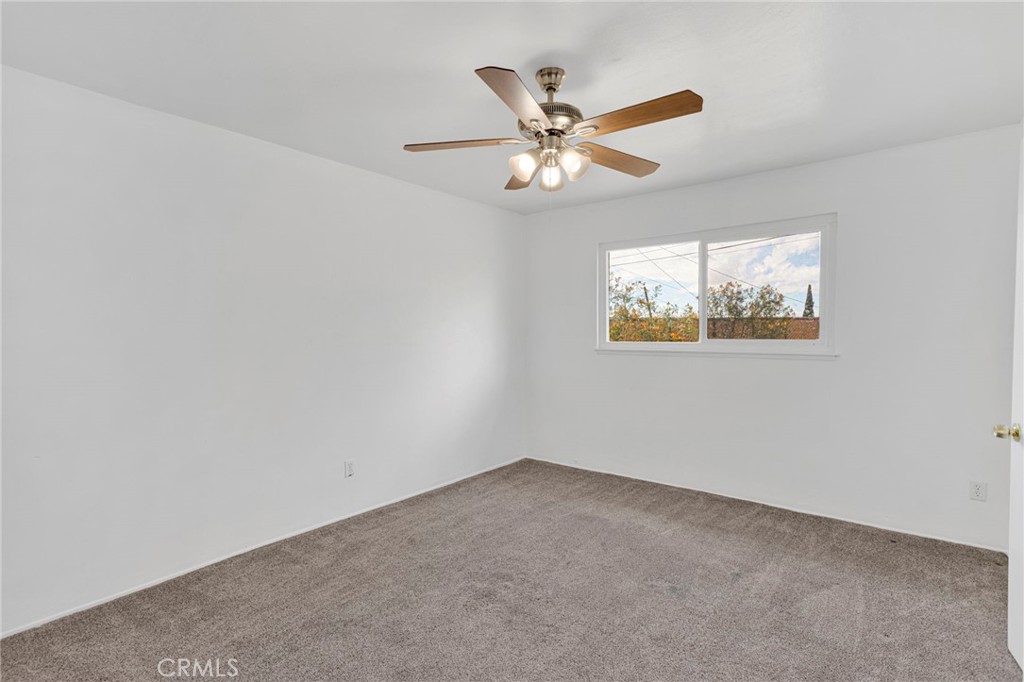 2567 Perth Court Barstow, CA 92311 - Photo 33 of 56 an empty room with windows and fan