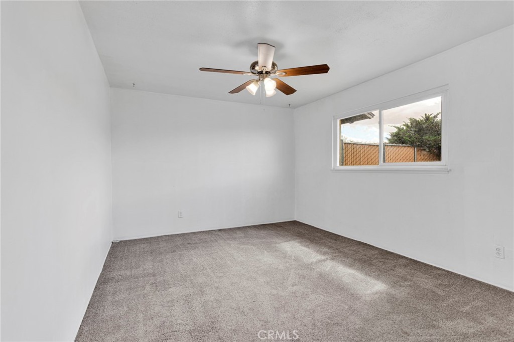 2567 Perth Court Barstow, CA 92311 - Photo 36 of 56 an empty room with a window and a fan