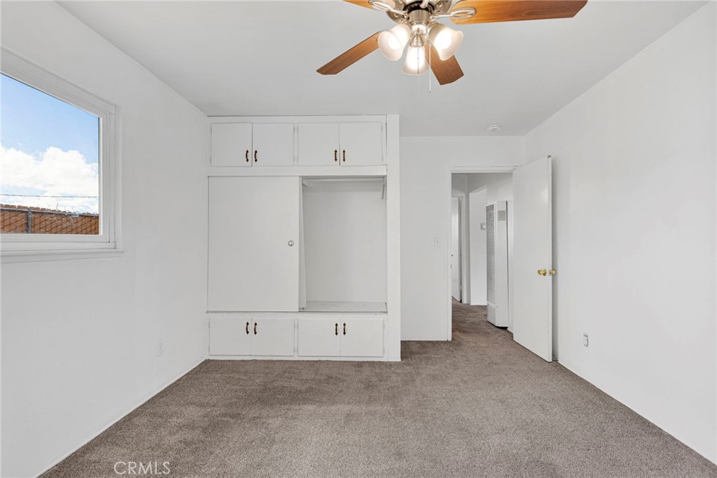 2567 Perth Court Barstow, CA 92311 - Photo 37 of 56 an empty room with windows and fan