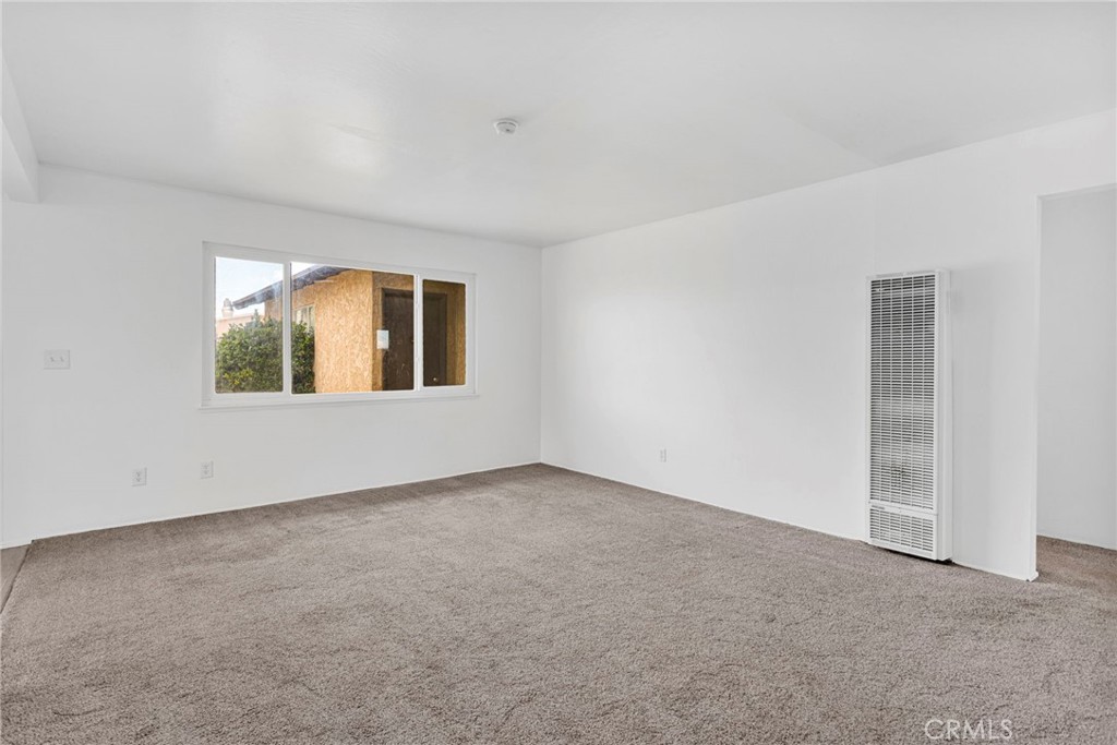 2567 Perth Court Barstow, CA 92311 - Photo 9 of 56 an empty room with a window