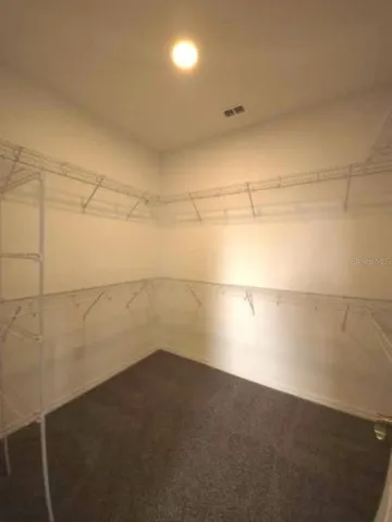 a spacious bathroom with a bathtub and a shower