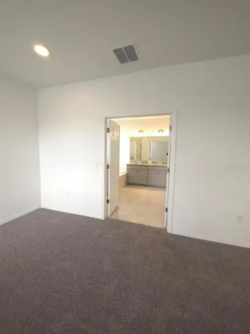 a large bathroom with a tub a sink shower and mirror