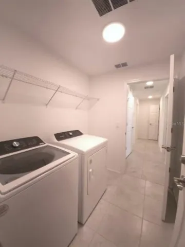 an empty room with a empty space and windows