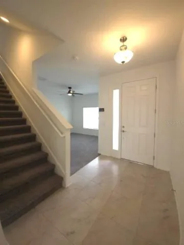 an empty room with a empty space and windows