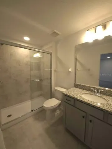 a big house with a big yard and large trees