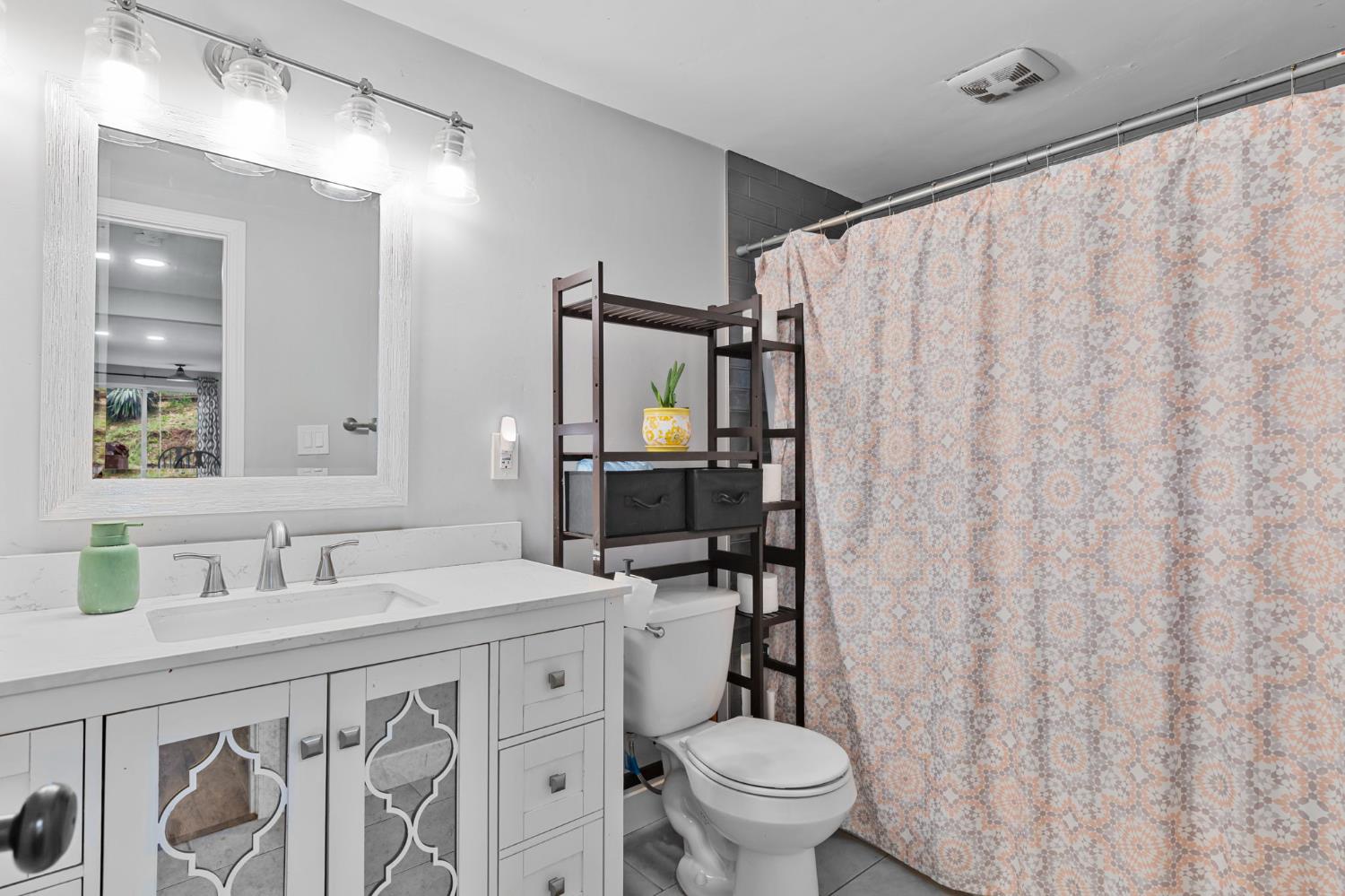 17721 Ridge Road Pine Grove, CA 95665 - Photo 6 of 21 a bathroom with a sink toilet and shower