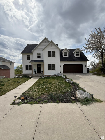 965 North 800 East Springville, UT 84663 - Photo 4 of 46 Modern farmhouse style home featuring a front lawn, concrete driveway, a garage, and a shingled roof