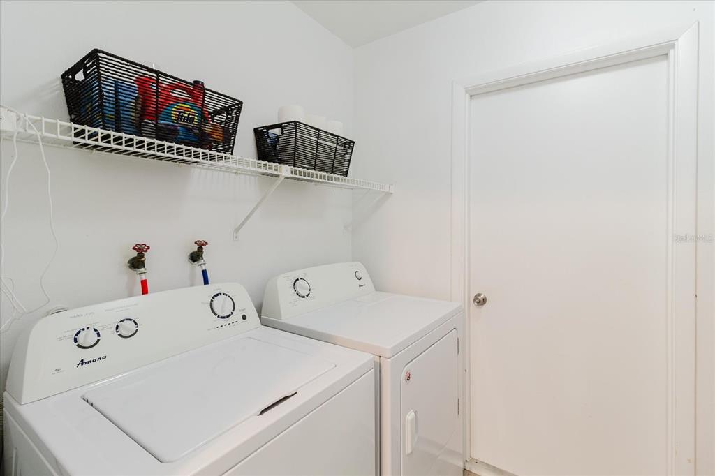 12526 Elgin Boulevard Spring Hill, FL 34609 - Photo 13 of 33 a utility room with dryer and washer