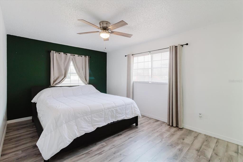 12526 Elgin Boulevard Spring Hill, FL 34609 - Photo 17 of 33 a bedroom with a bed and window