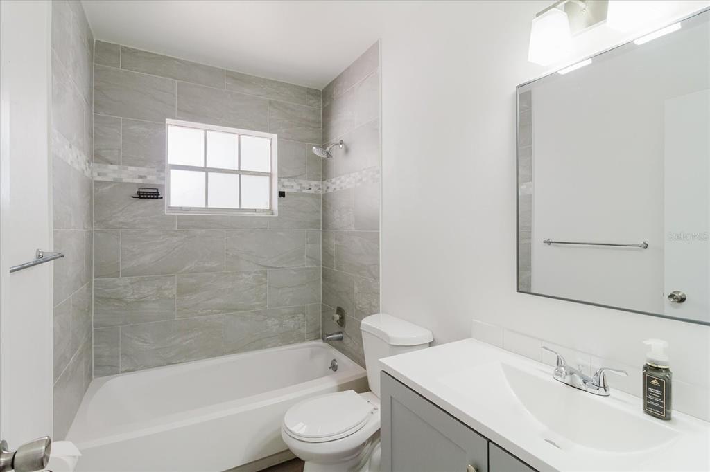 12526 Elgin Boulevard Spring Hill, FL 34609 - Photo 20 of 33 a bathroom with a sink toilet and shower