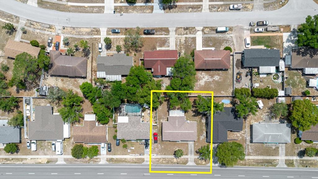 12526 Elgin Boulevard Spring Hill, FL 34609 - Photo 2 of 33 an aerial view of houses with yard