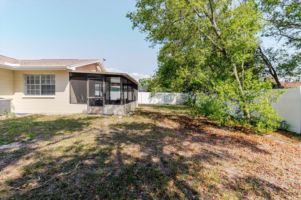 12526 Elgin Boulevard Spring Hill, FL 34609 - Photo 32 of 33 a front view of a house with a yard