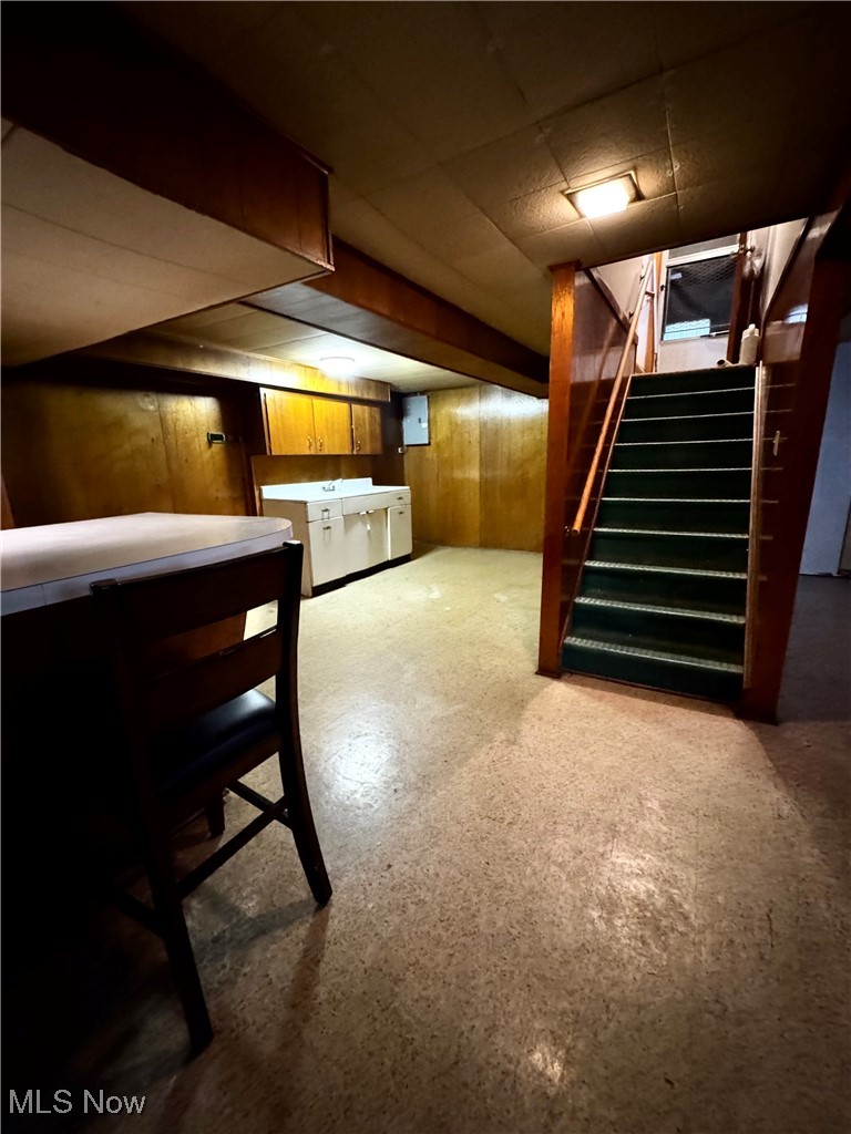 4531 8th Street Northwest Canton, OH 44708 - Photo 13 of 19 Basement featuring bar and wood walls